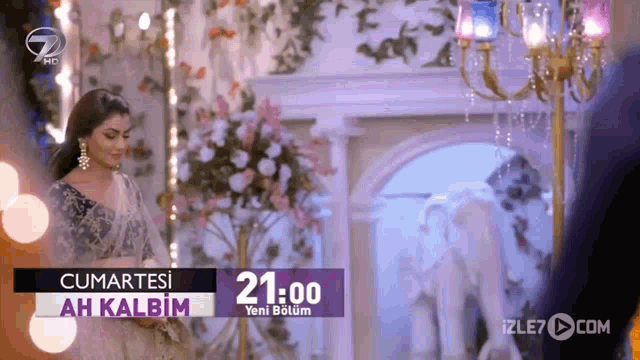 a woman is standing in front of a purple sign that says 21:00 on it