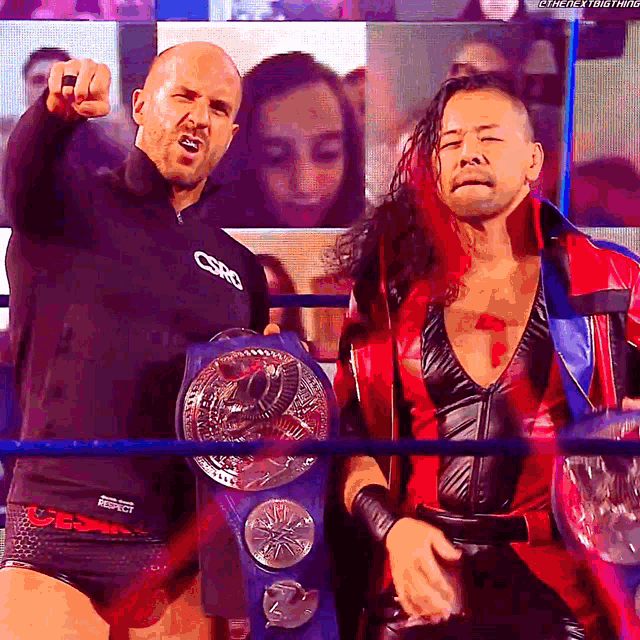 two wrestlers in a ring with one wearing a shirt that says csro on it