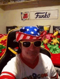 a funko sign hangs above a person wearing sunglasses and a hat