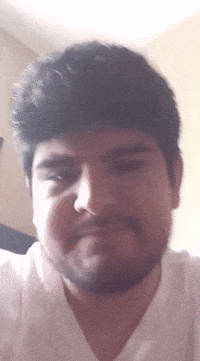 a man with a beard wearing a white shirt
