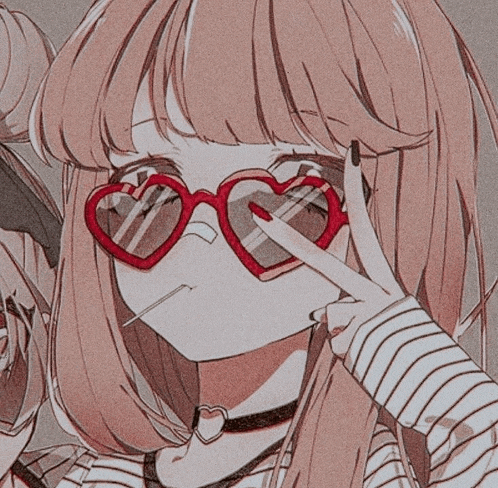 a girl is wearing heart shaped sunglasses and giving a peace sign