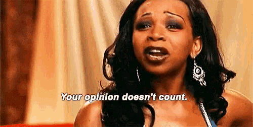 a woman is sitting on a couch and says `` your opinion does n't count '' .