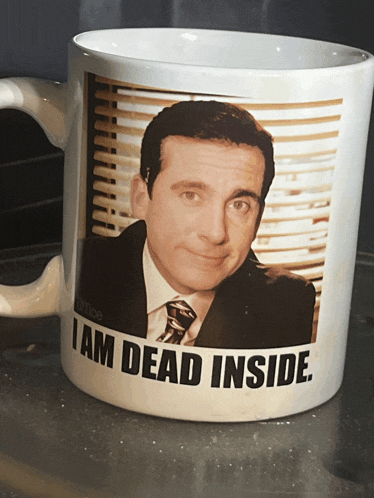 a mug with a picture of michael scott and the words i am dead inside