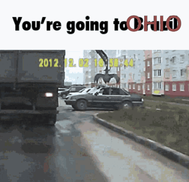 a picture of a car being lifted by a crane and the words you 're going to ohio