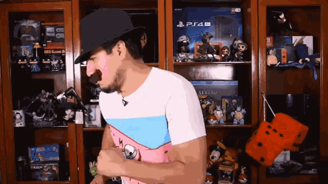 a man is standing in front of a playstation pro