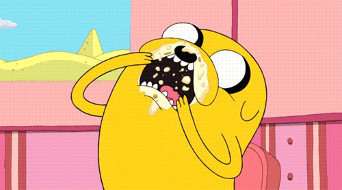 a cartoon character with his tongue hanging out and a pyramid in the background
