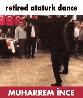 a man is dancing in front of a crowd with the words retired ataturk dance muharram ince on the bottom