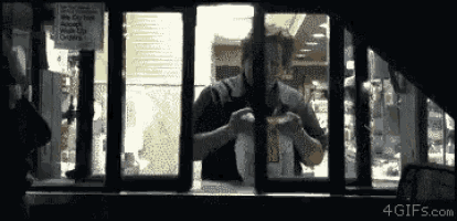a sign that says we do not accept walk up orders is behind a window