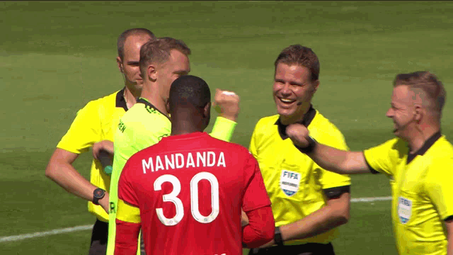 a soccer player with the number 30 on his back