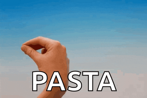 a hand holding a piece of pasta in front of a blue sky