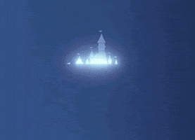 a silhouette of a castle is projected onto a blue background