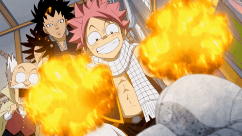 a group of cartoon characters are standing around a pile of fire
