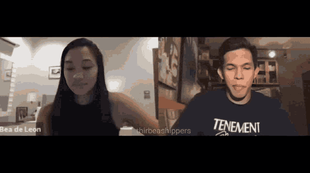 a man and a woman are on a video call and the man is wearing a shirt that says tenement