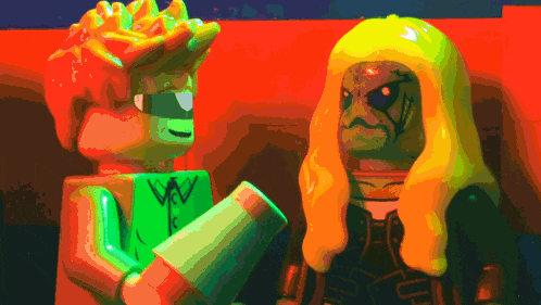 a green lego figure with the letter w on it