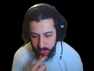 a man with a beard is wearing headphones