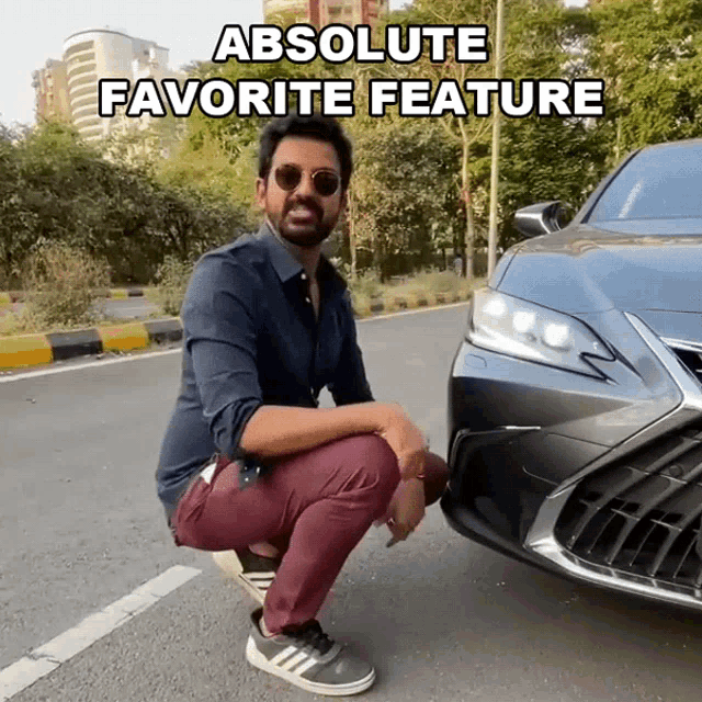 a man squatting next to a car with the words absolute favorite feature written above him