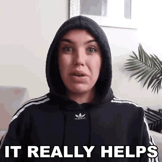a woman wearing a black adidas hoodie says it really helps .