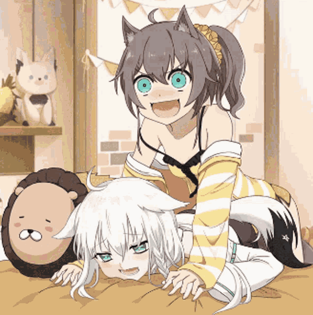 two anime girls are laying on a bed and one has a cat ear