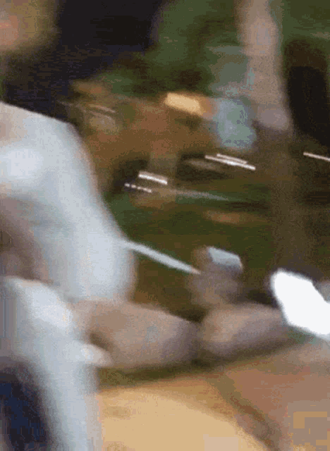 a blurry picture of a person holding a cellphone