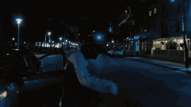 a man wearing a blue shirt that says billabong