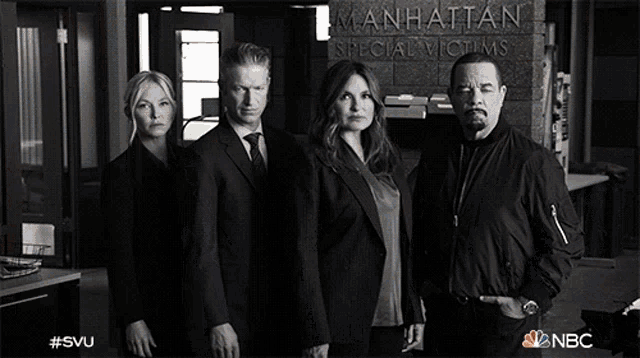 a group of people standing in front of a manhattan special victims building