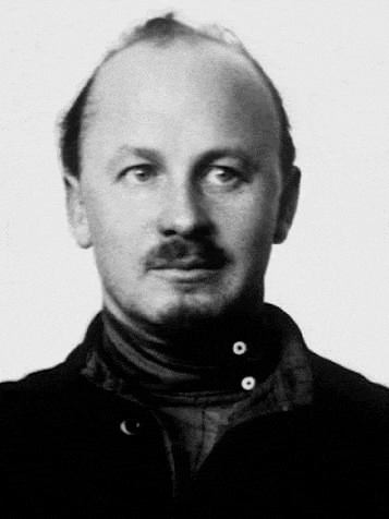 it is a black and white photo of a bald man with a mustache .