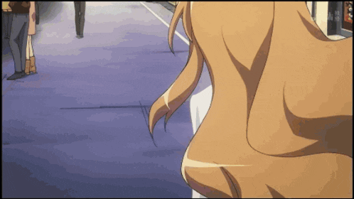 a girl with long hair is walking down a street