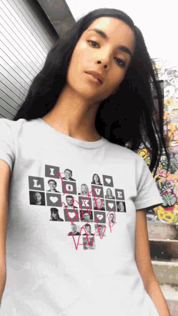 a woman is wearing a white t-shirt that says i love you