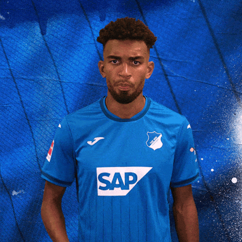 a man is wearing a blue shirt with the word sap on it