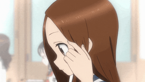 a close up of a cartoon girl covering her eyes