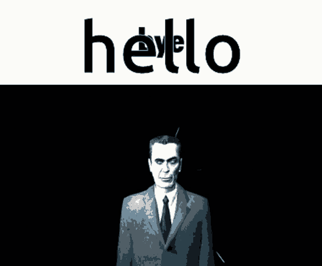 a man in a suit and tie stands in front of a white background that says hello