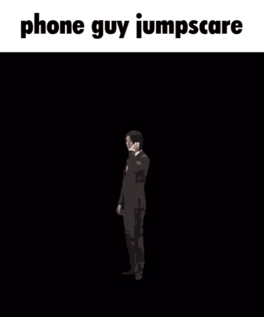 a man in a suit and tie talking on a cell phone