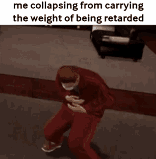 a man in red pants is standing in a living room with a caption that says me collapsing