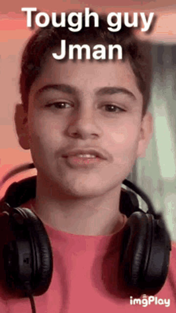 a young man wearing headphones with the words tough guy jman above him