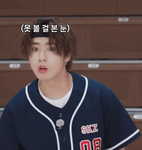 a boy wearing a blue baseball jersey with the number 08 on the front
