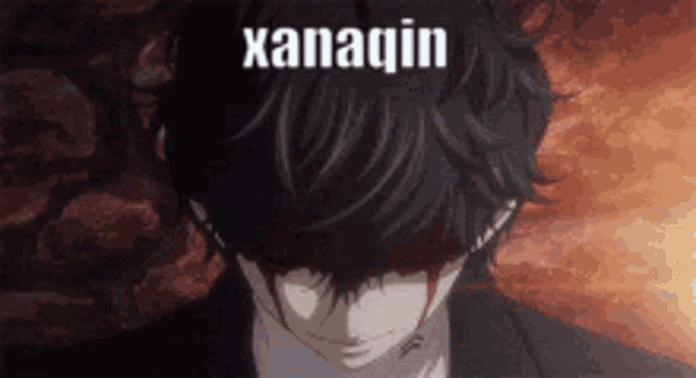 a man with blood coming out of his eyes and the word xanaquin written above him