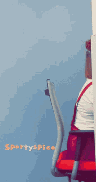 a person is sitting in a chair with the words sportyspice written on the bottom