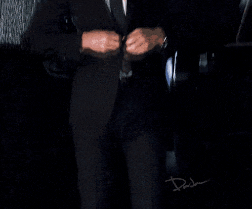 a pixel art of a man in a suit and tie with the word dada written below him