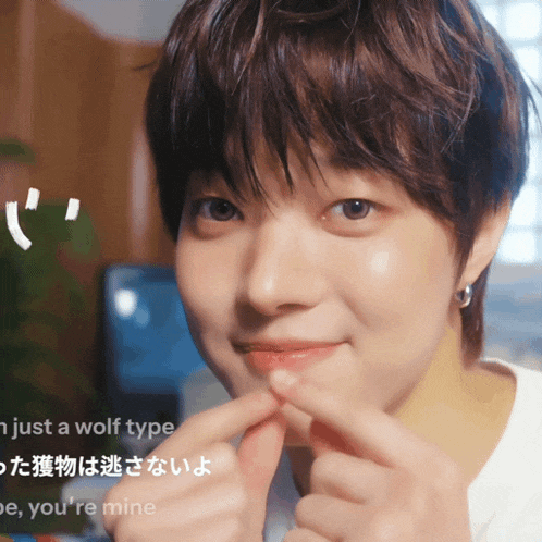 a close up of a person 's face with the words i 'm just a wolf type