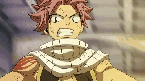a close up of a person wearing a scarf around their neck and making a funny face .