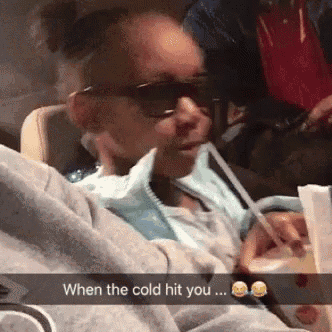 a girl wearing sunglasses is drinking through a straw with the caption when the cold hit you ...