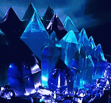 a bunch of blue crystals in the dark