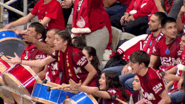 a group of people wearing shirts that say ucam