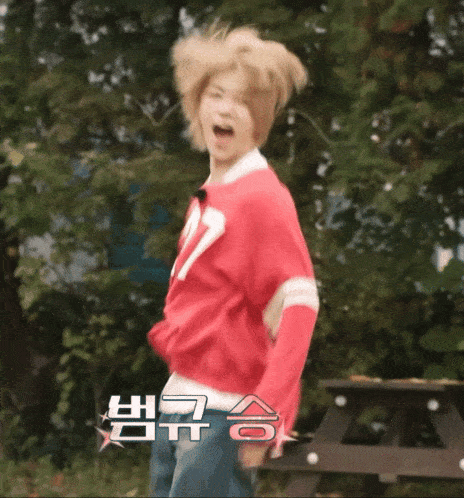 a person wearing a red sweater with the number 17 on it