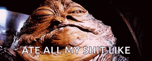 a close up of a statue of jabba the hutt with the words ate all my shit like below it