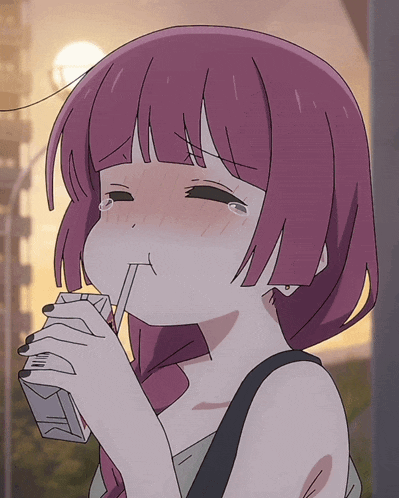 a girl with pink hair is drinking from a carton