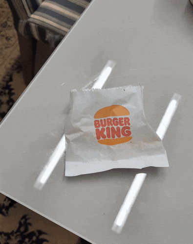 a bag of burger king sitting on a table