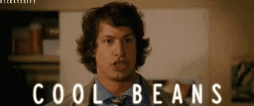 a man in a suit and tie says cool beans .