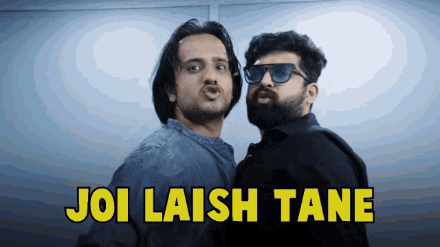 two men standing next to each other with the words joi laish tane written on the bottom
