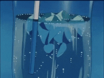 a glass with ice and a straw in it